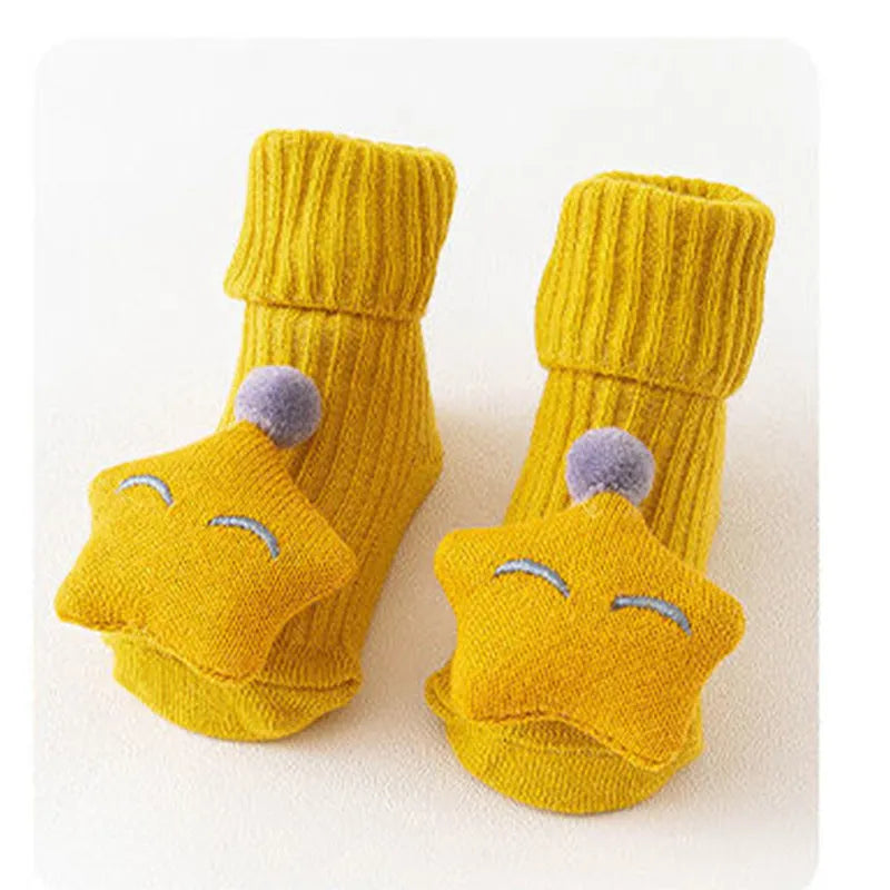 Cotton baby socks in multiple colours and prints including panda, lion, bows, and stars on a white background.
