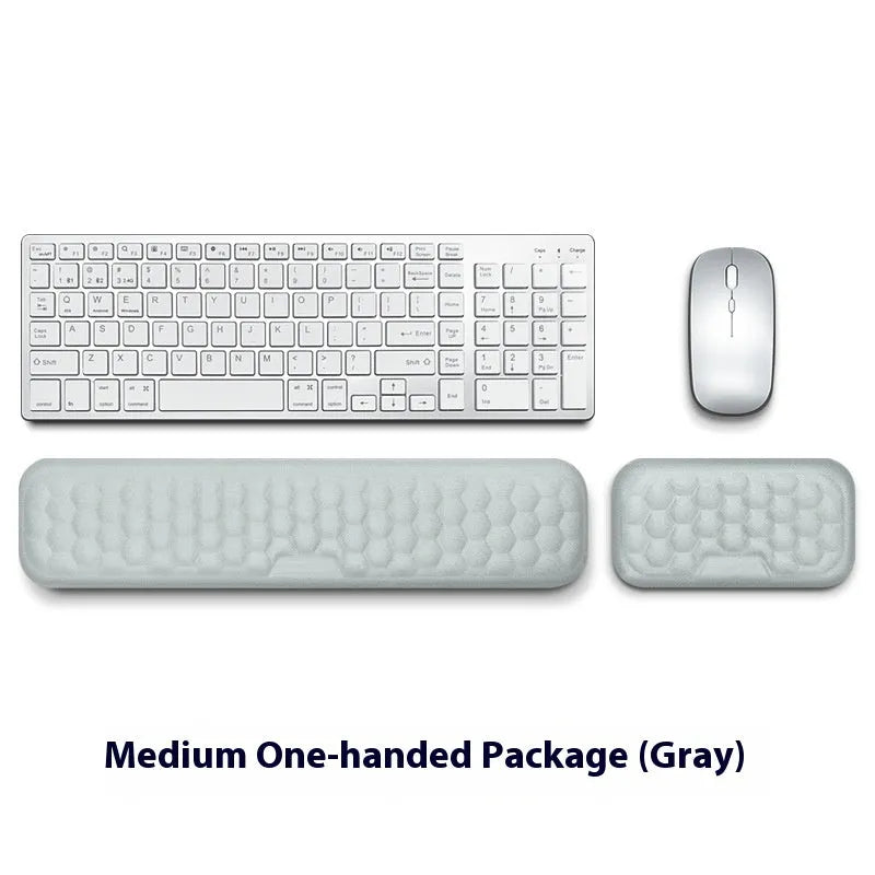 Grey and black memory foam mouse wrist pads with silicone bases, shown in cloth and leather cover options.