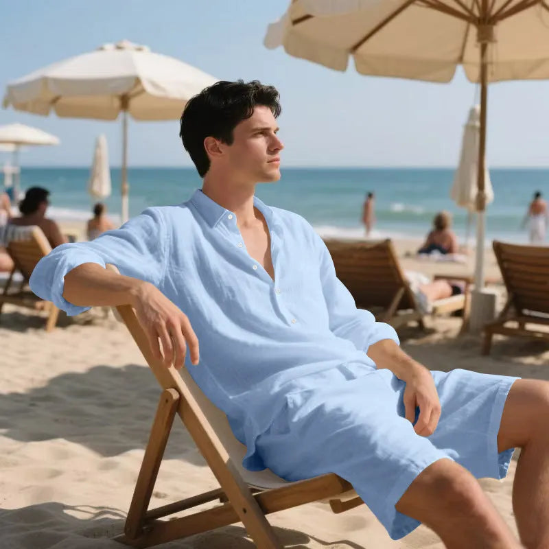 Linen long sleeve shirt and matching shorts beach set in light blue, laid flat.