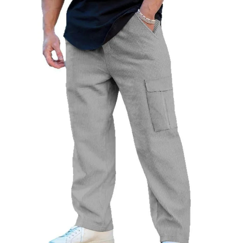Men's corduroy cargo trousers in loose fit wide-leg design with elastic waist