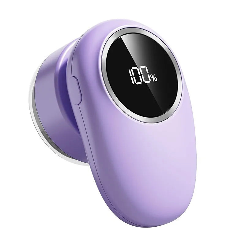 Beige and purple digital fur ball trimmers with USB-C charging cable and multiple cutter heads on a fabric surface
