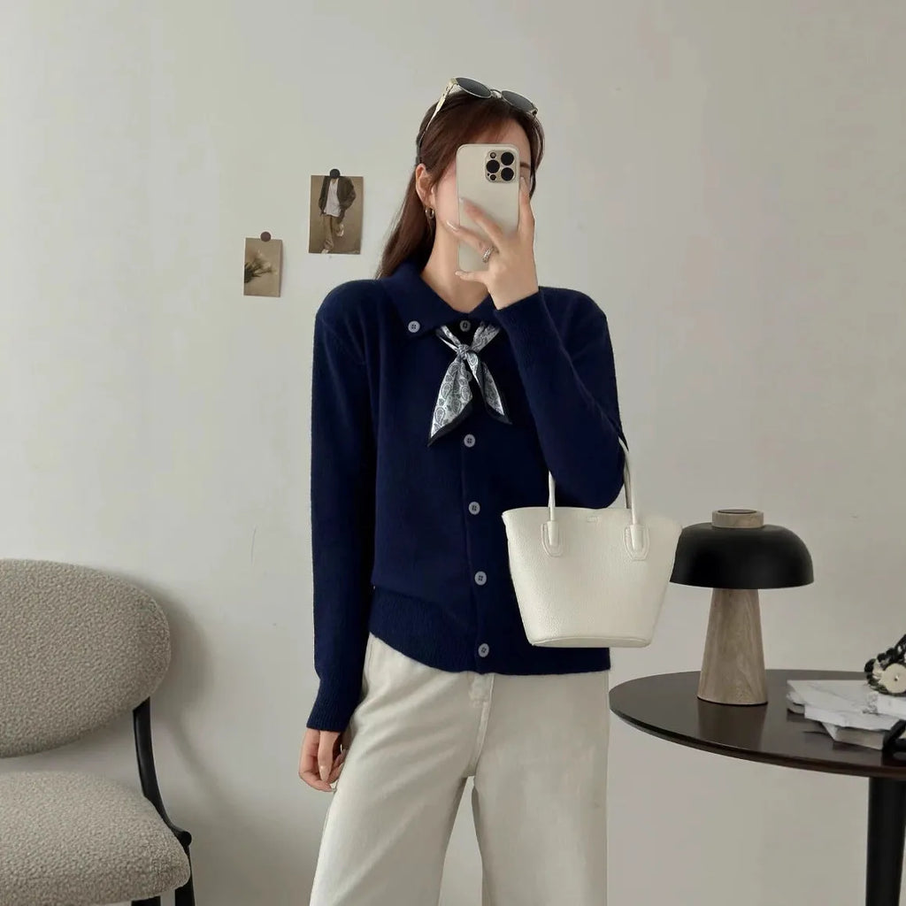 Women's milky white cardigan sweater with a built-in lapel scarf collar and long sleeves.