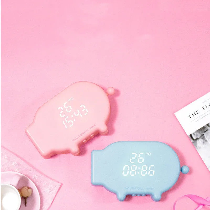 Blue and pink multifunctional LED alarm clock showing time and temperature with USB charging port