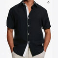 Man wearing a short sleeve floral print shirt in cardigan style, suitable for summer.