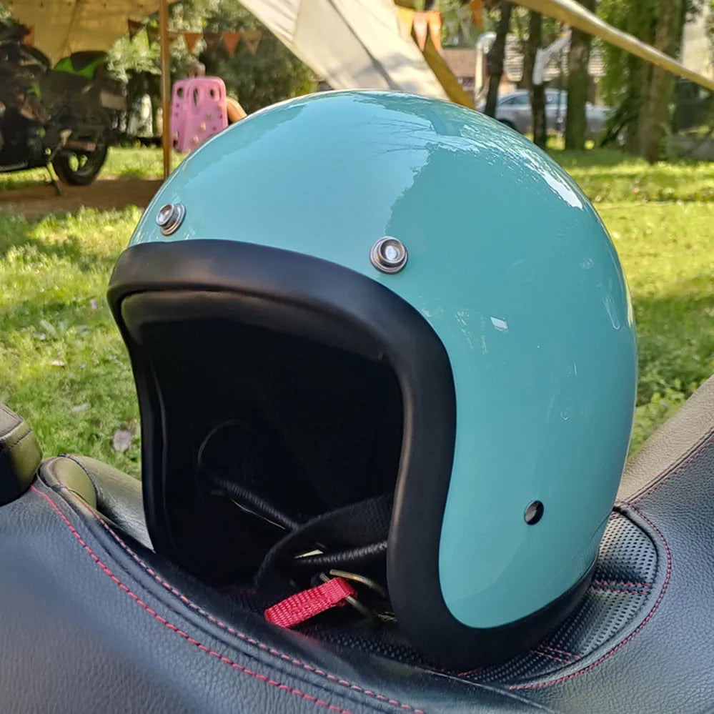Retro-style half motorcycle helmet in fibreglass, shown in a cement grey colour option.