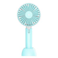 Blue handheld USB fan with three-speed control and oscillating head on desktop