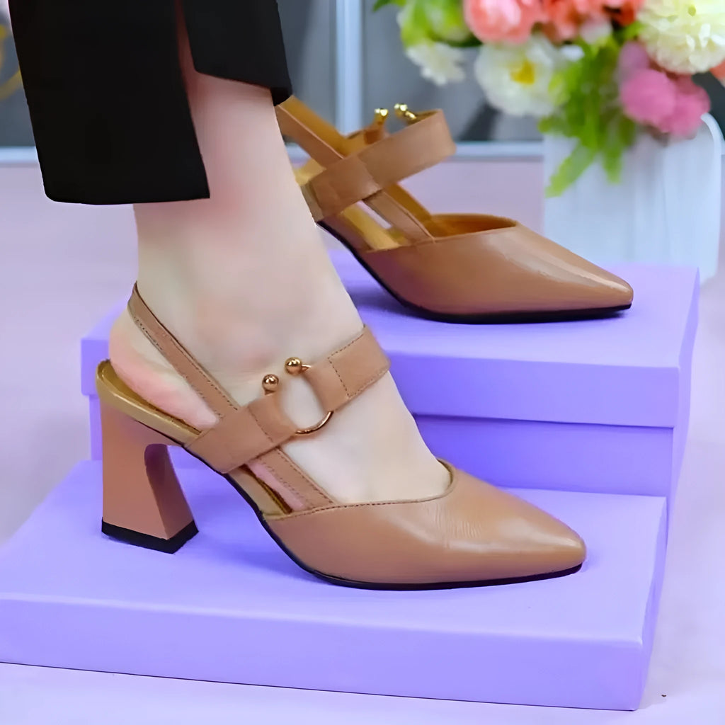 Women's apricot leather closed-toe backless sandals with a chunky heel on a neutral background.