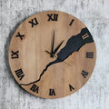 Modern simple wooden wall clock with crack design on a plain wall