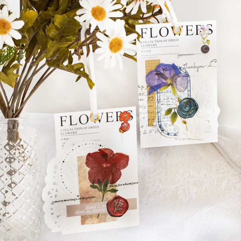 Pack of 40 decorative dried flower design sticker sheets in eight colours including purple, blue, and orange.