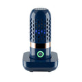 Blue capsule fruit and vegetable purifier with mechanical button and USB charging, placed in water