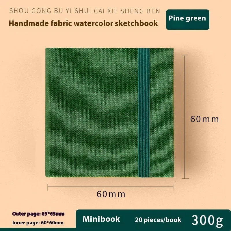 Feiluniao handmade fabric watercolour notebook in 185mm portable size, showing artistic cover design.