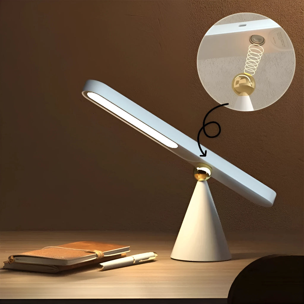 Geometric wireless table lamp with magnetic suction on metal surface showing USB connection