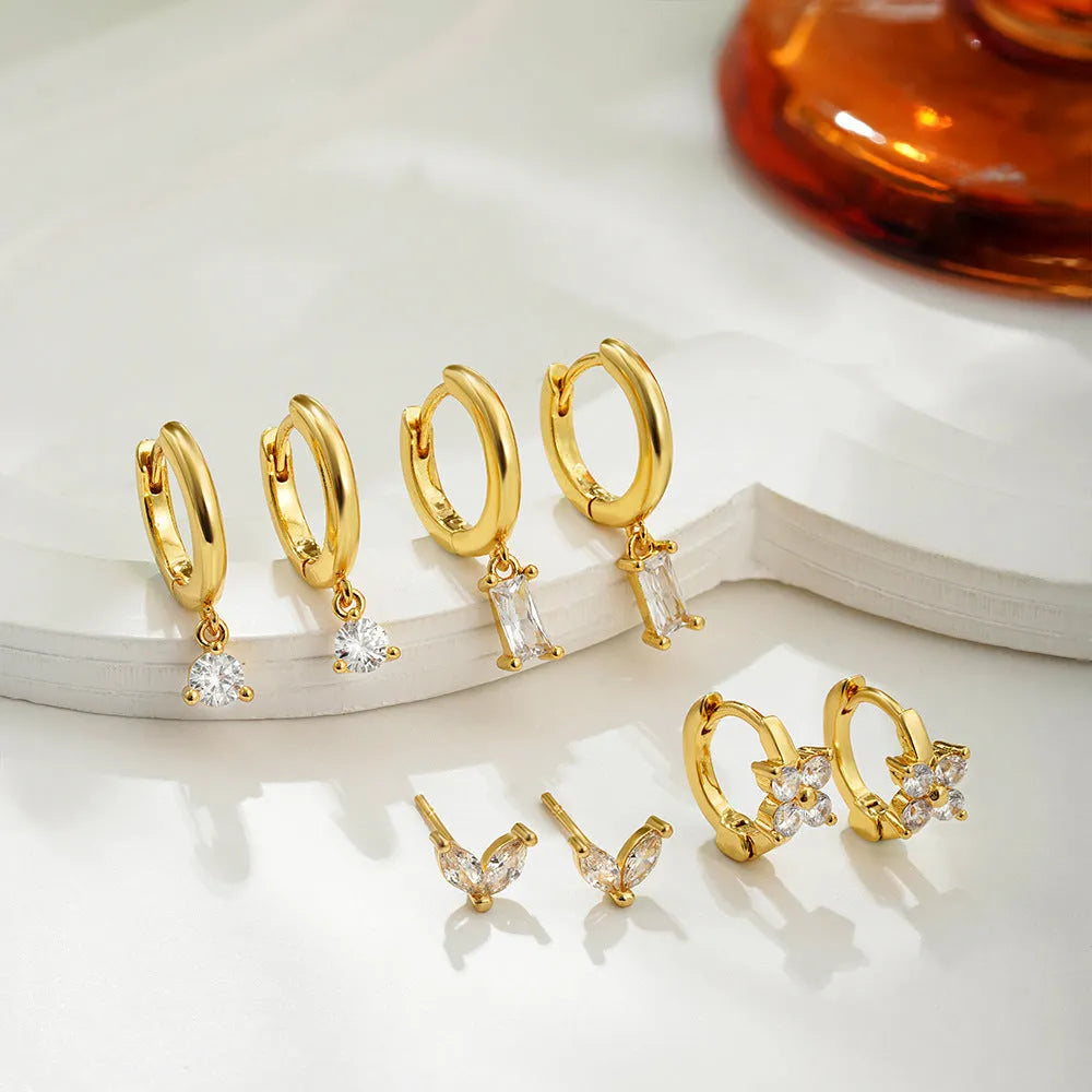 Geometric copper earring set with gold electroplated finish showing star and square shapes