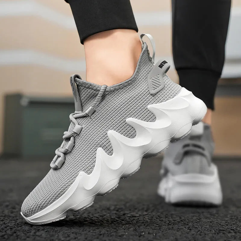 Men's black sock-like low-top lace-up shoes with round toe and flat rubber sole on white background