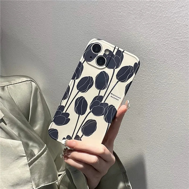 Black silicone iPhone case with a printed tulip floral design on the back.