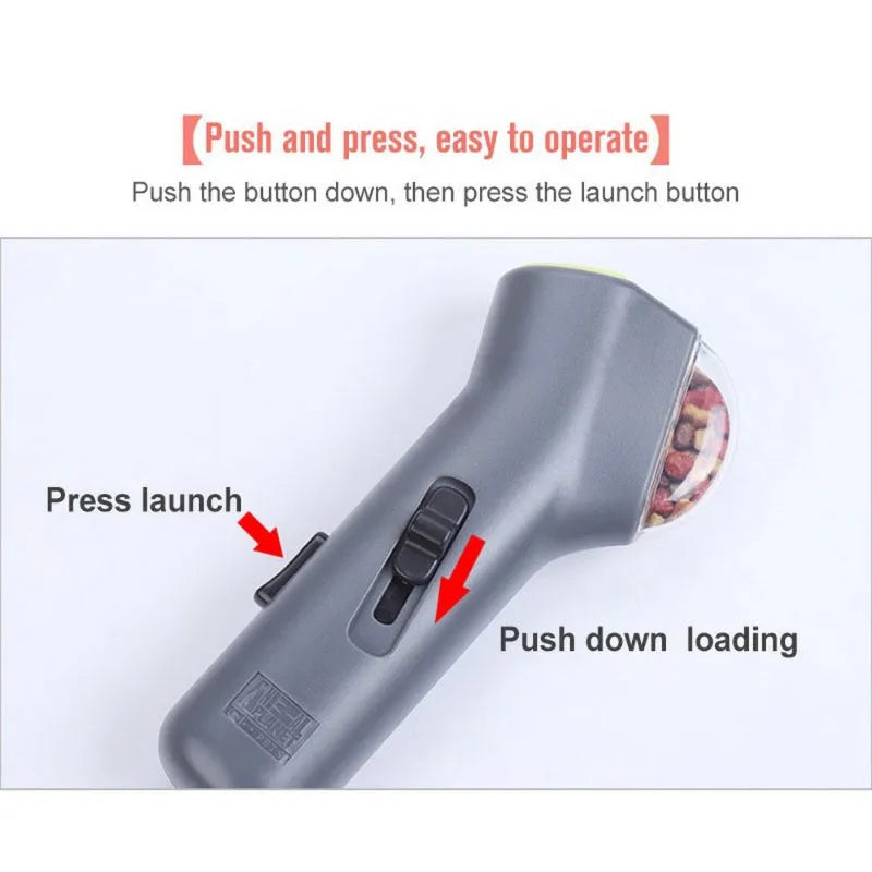 Grey pet snack launcher toy measuring 18cm with spring trigger mechanism for 2-3 metre treat launching