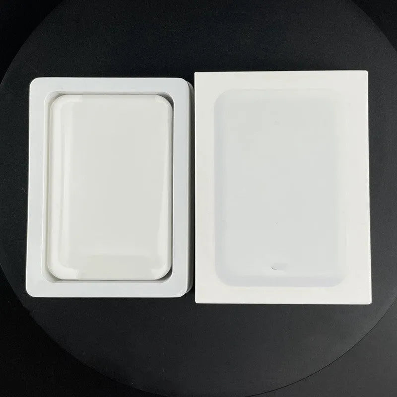 Magnetic wireless charging power bank in white with creative foot design showing charging surface