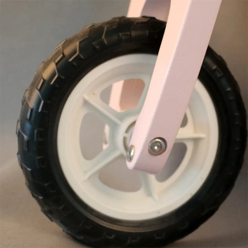 Pink wooden toddler balance scooter with 10-inch wheels for children aged 1 to 6 years.