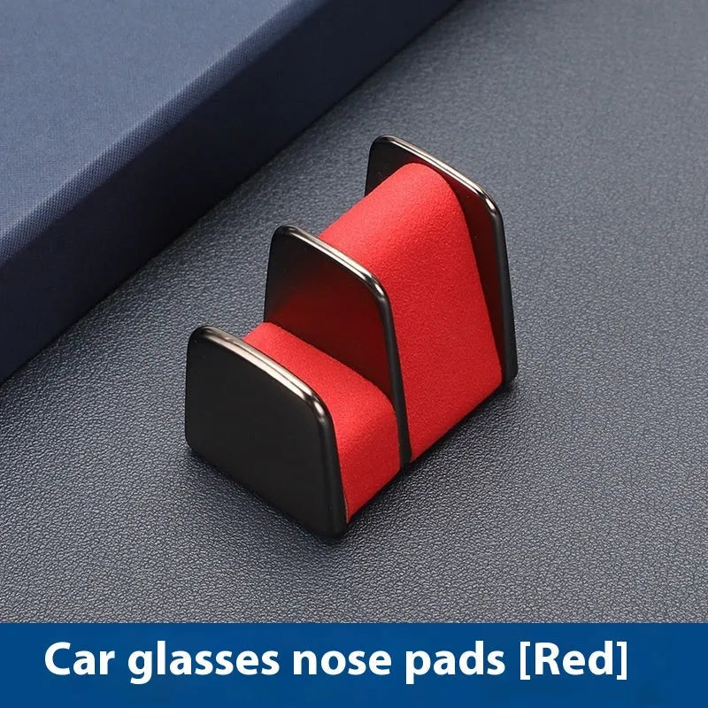 Zinc alloy and leather car dashboard clip for holding glasses in black, grey, green, or red.