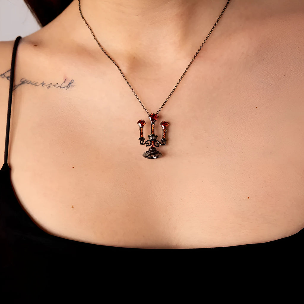Close-up of a Gothic zinc alloy clavicle chain with a detailed hollow candlestick pendant on a cross chain.
