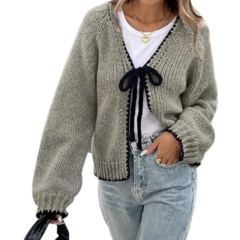 Gray lace-up front cardigan sweater with white crochet flower details and loose long sleeves.