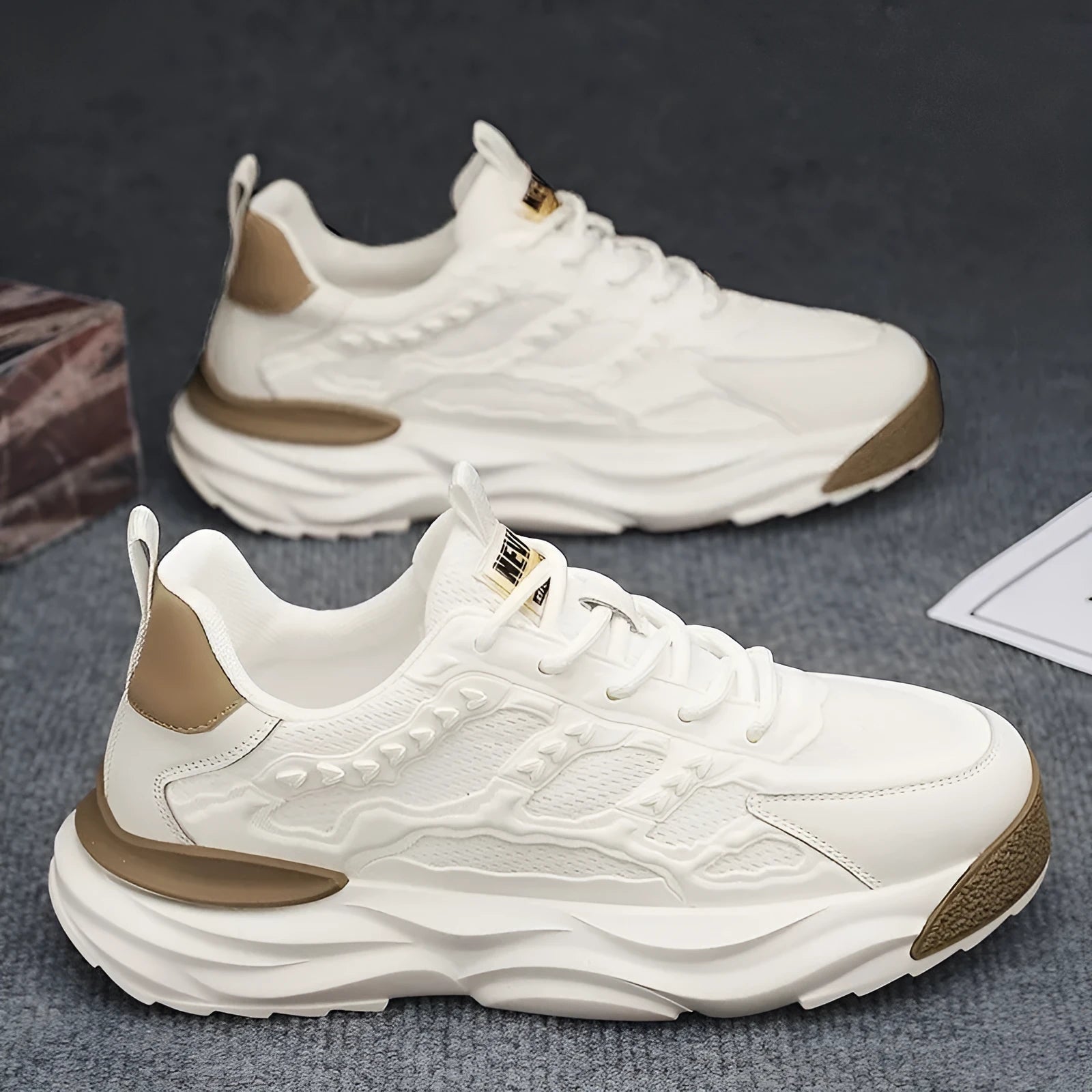 Men's solid colour casual shoes with breathable PU mesh upper and round toe in black and white.