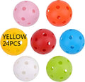 Six coloured 42mm golf practice balls in red, orange, blue, green, white and yellow arranged on putting surface