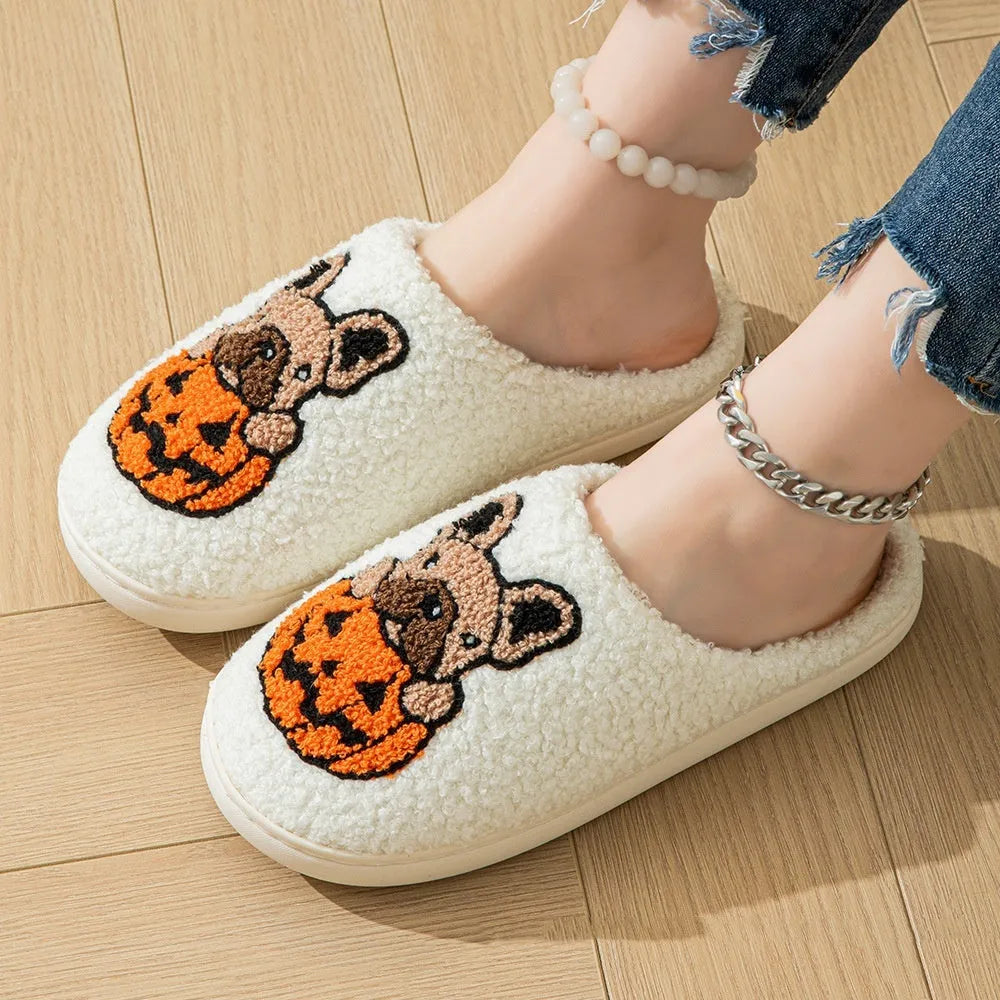 Halloween pumpkin design plush slippers with TPR rubber soles in white or black.