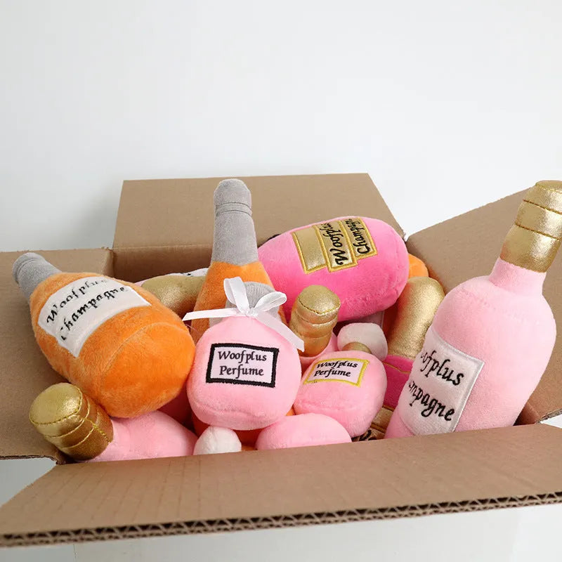 Green plush pet toy shaped like a wine bottle for dogs or cats to play with.