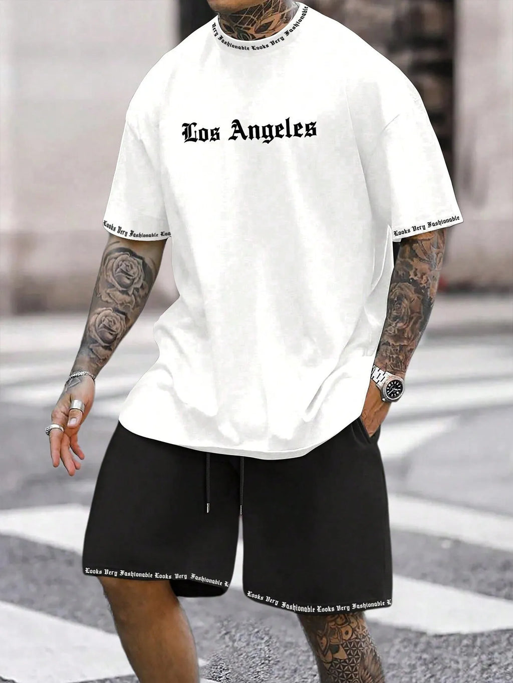 Men's grey sports short sleeve top and matching shorts set on hanger