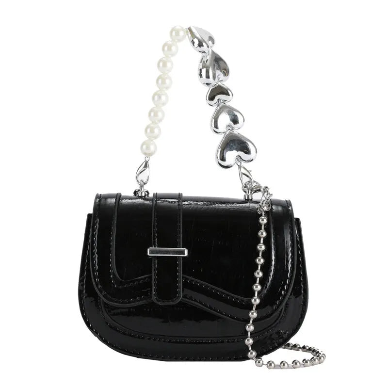 Silver laser pearl women's mini crossbody bag with a horizontal square shape and single shoulder strap.