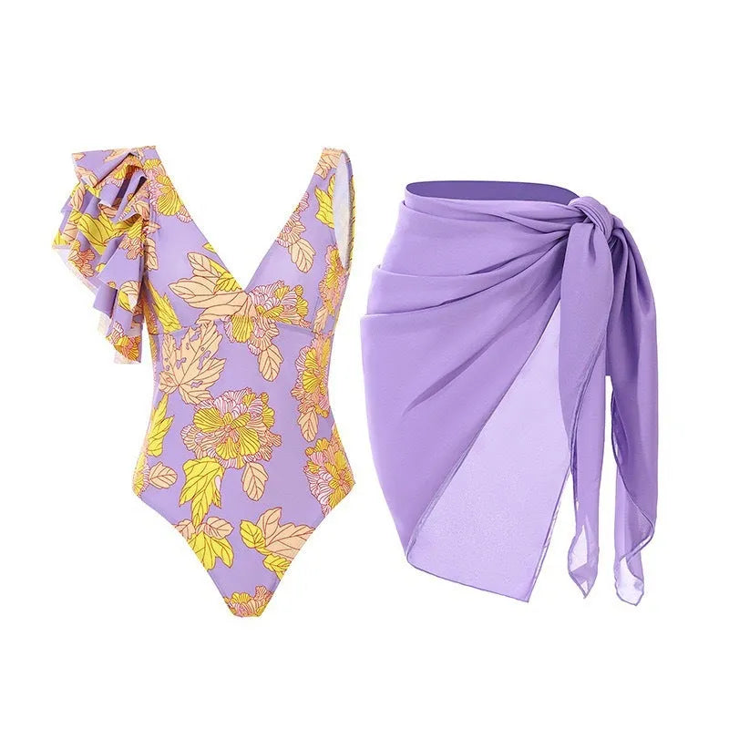 Solid colour women's one-piece swimsuit with thin spaghetti straps and a matching detachable skirt.