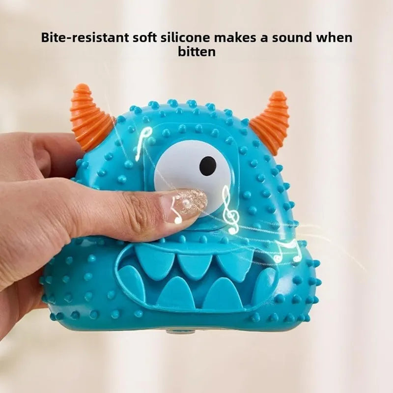 Little monster vocal dog toy in blue with exaggerated eyes, horns, and teeth; made of bite-resistant silicone.