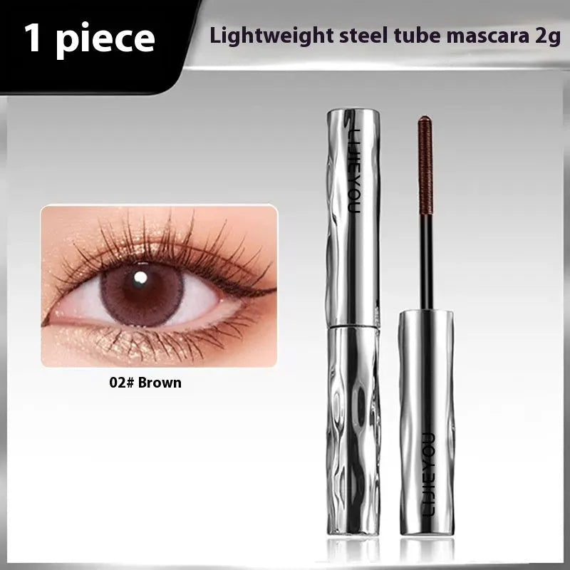 Waterproof black and brown steel tube mascara with optional eyelash curler.