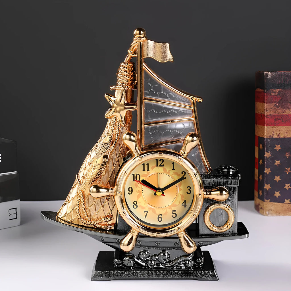 Modern metallic-finish bedroom alarm clock in gold or silver on a bedside table.