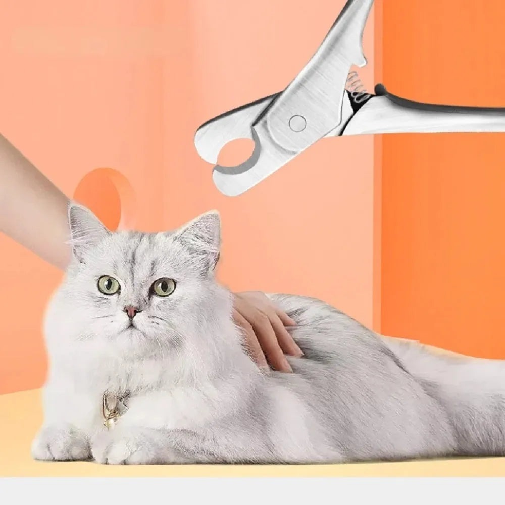 Silver stainless steel pet nail clipper with ergonomic handle and safety guard for dog and cat grooming.