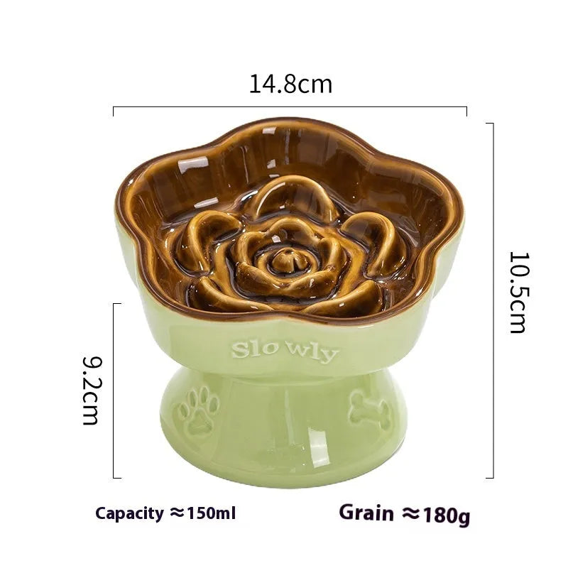 Black chin-high foot ceramic pet bowl for dogs and cats on a flat surface.