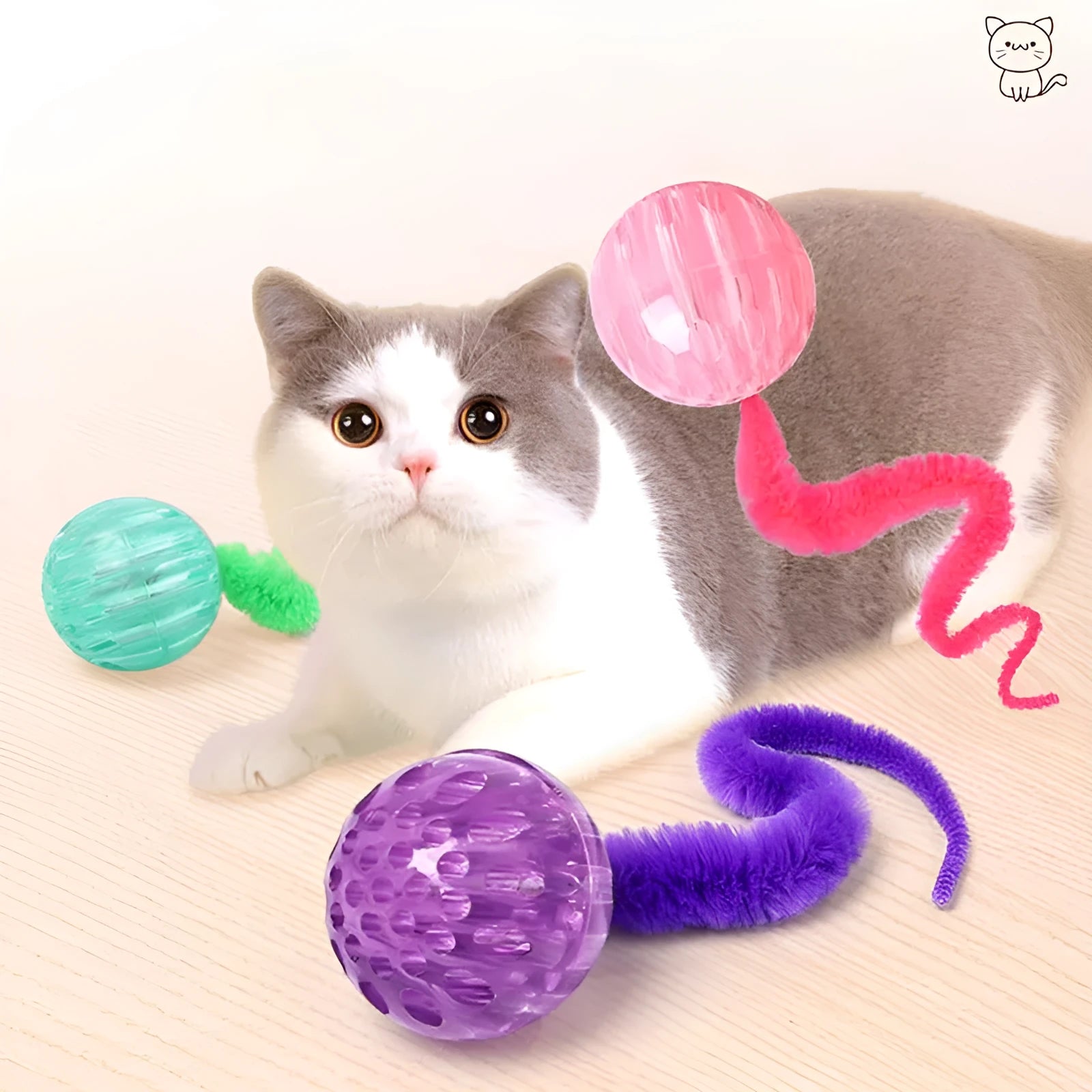 Interactive cat ball toy with worm tail attachment in green, pink, or purple colours
