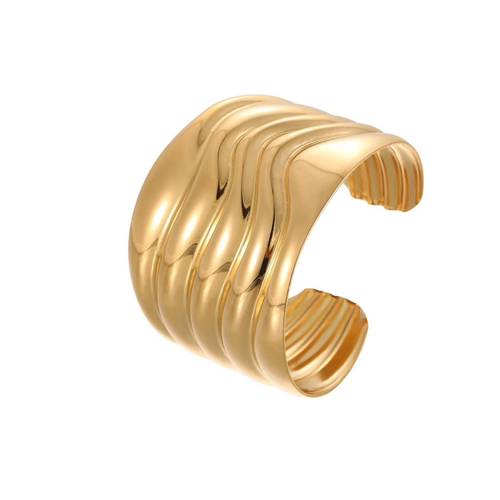 Gold plated wide women's bracelet with geometric wave design and niche opening