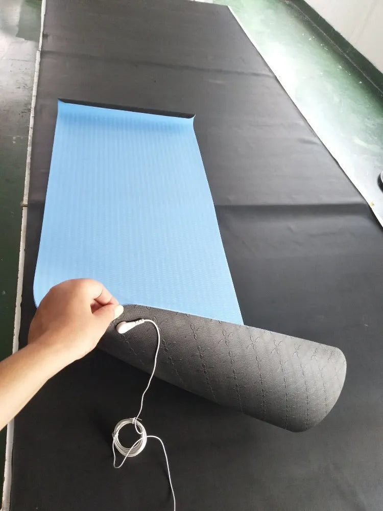 Blue conductive yoga mat with botanical plant pattern, grounding wire, and non-slip surface measuring 182x61cm