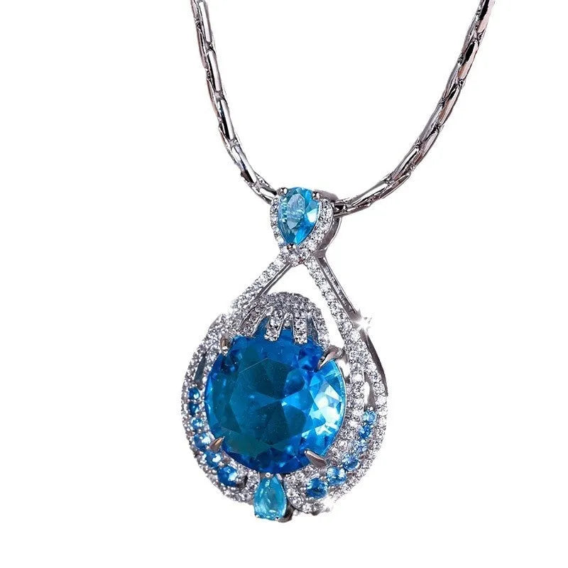 Geometric women's necklace with blue crystal fireworks cut pendant on water wave chain