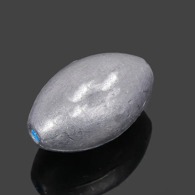 Plastic core olive lead sinker with scale tongxin pattern and rugby shape for sea fishing