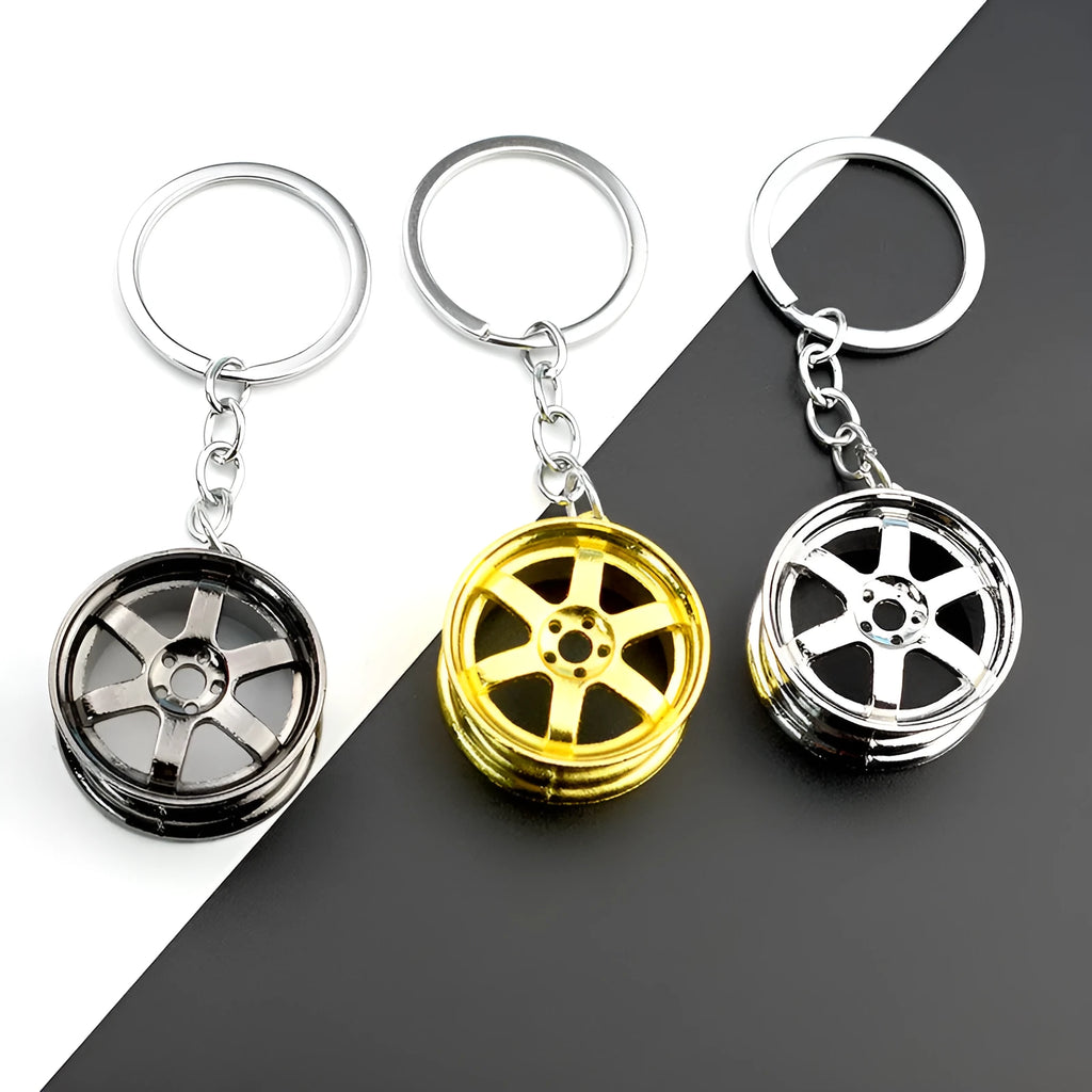 Zinc alloy wheel hub car keychain in gold, silver and gun black colour options