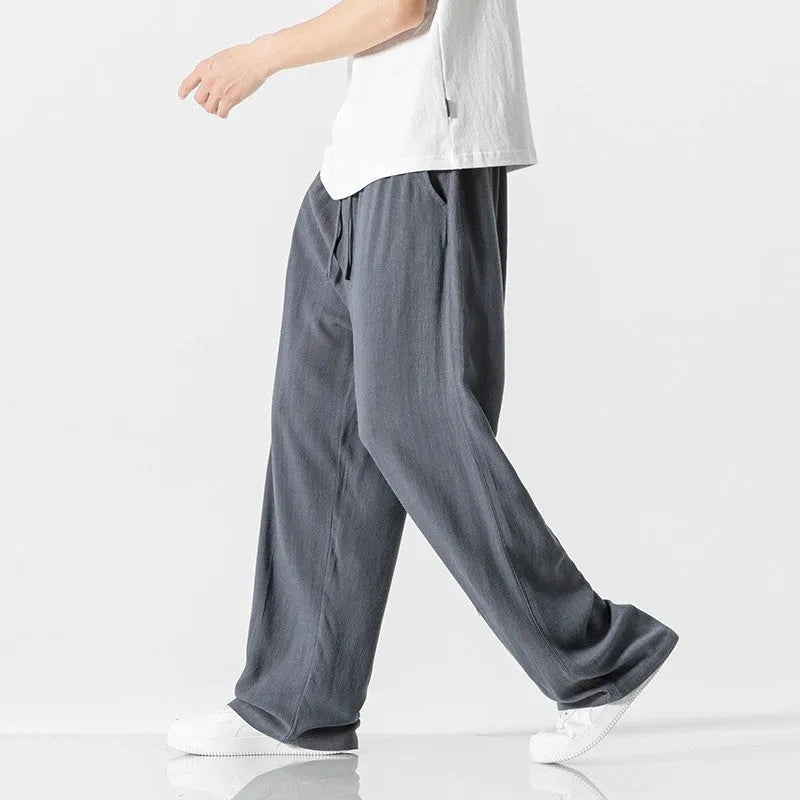 Men's cropped linen trousers in bamboo fibre with a loose straight-leg fit and drawstring waist.