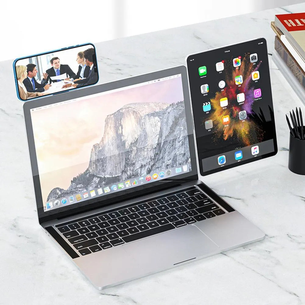 Black aluminium laptop phone holder with magnetic mount attached to computer monitor side