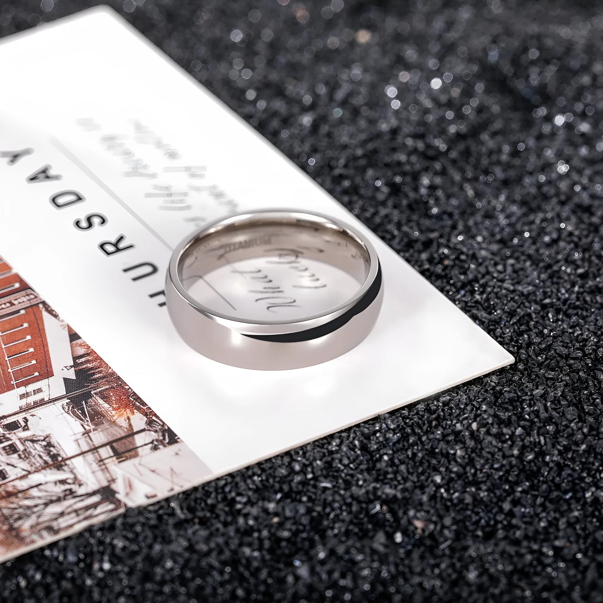 Silver titanium steel minimalist ring shown in various widths on a plain background.