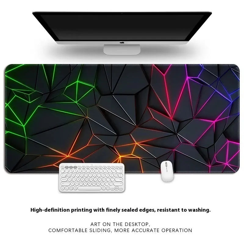 Natural rubber computer desk mat with printed pattern and overlock edge, shown on a wooden desk.