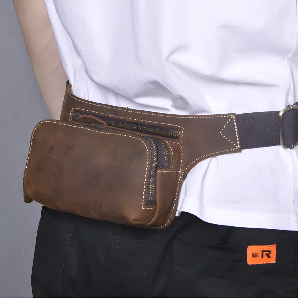 Brown top-layer cowhide leather men's sports waist bag with a pull closure.