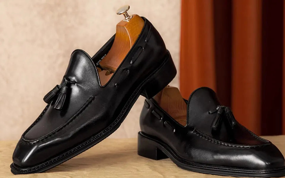 Men's black genuine leather loafers with fringed British styling and slip-on design