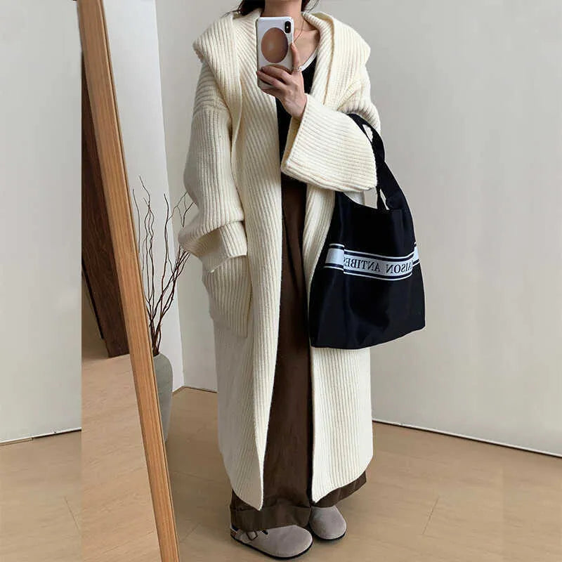 Loose hooded acrylic cardigan coat for women in beige colour with 80cm length and raglan sleeves
